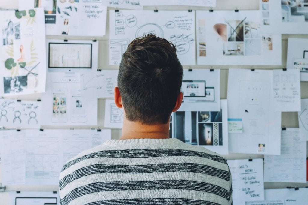 man standing in front of planning board